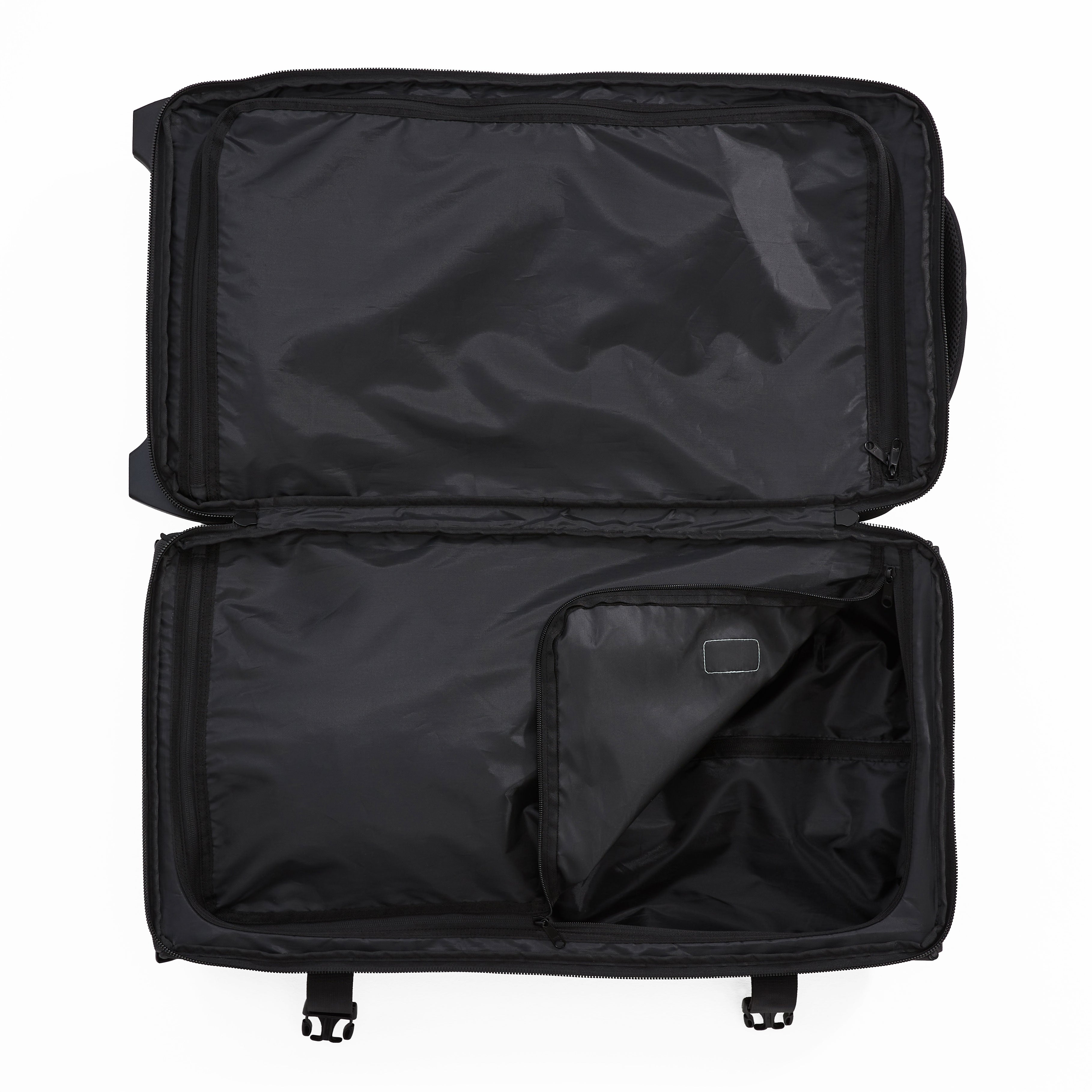 Ela Mo™ Reisetasche mit Rollen 42 Liter | Beauty in Darkness. Geöffnete Reisetasche mit sichtbarem Innenbereich.
