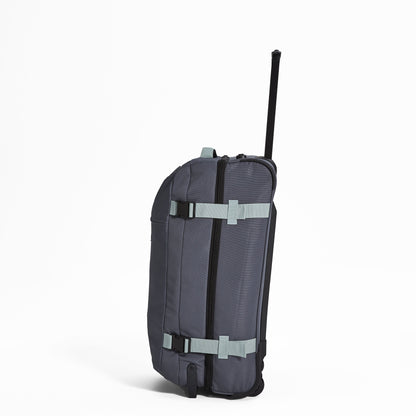 Ela Mo™ Reisetasche mit Rollen 78 Liter | Darkgrey Mint. Reisetasche mit Klickverschluss von der linken Seite.
